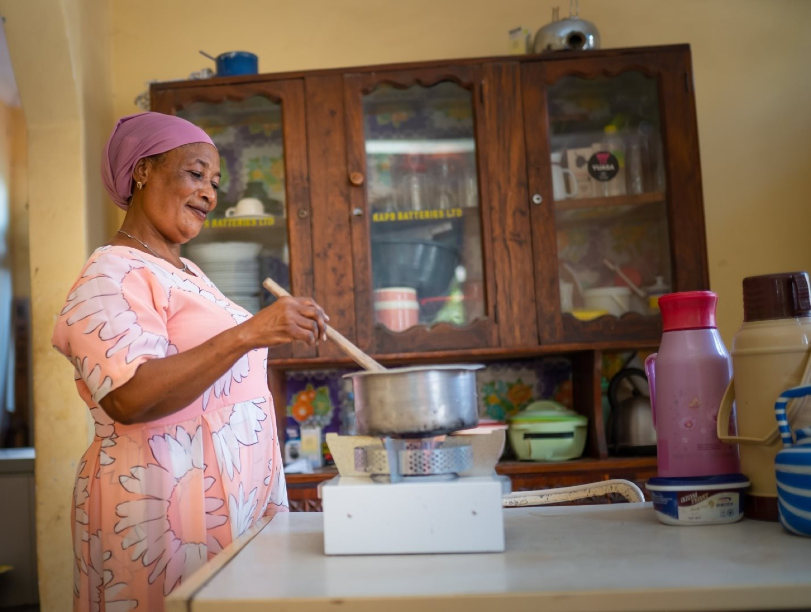 Woman cooking on an efficient stove in urban Tanzania